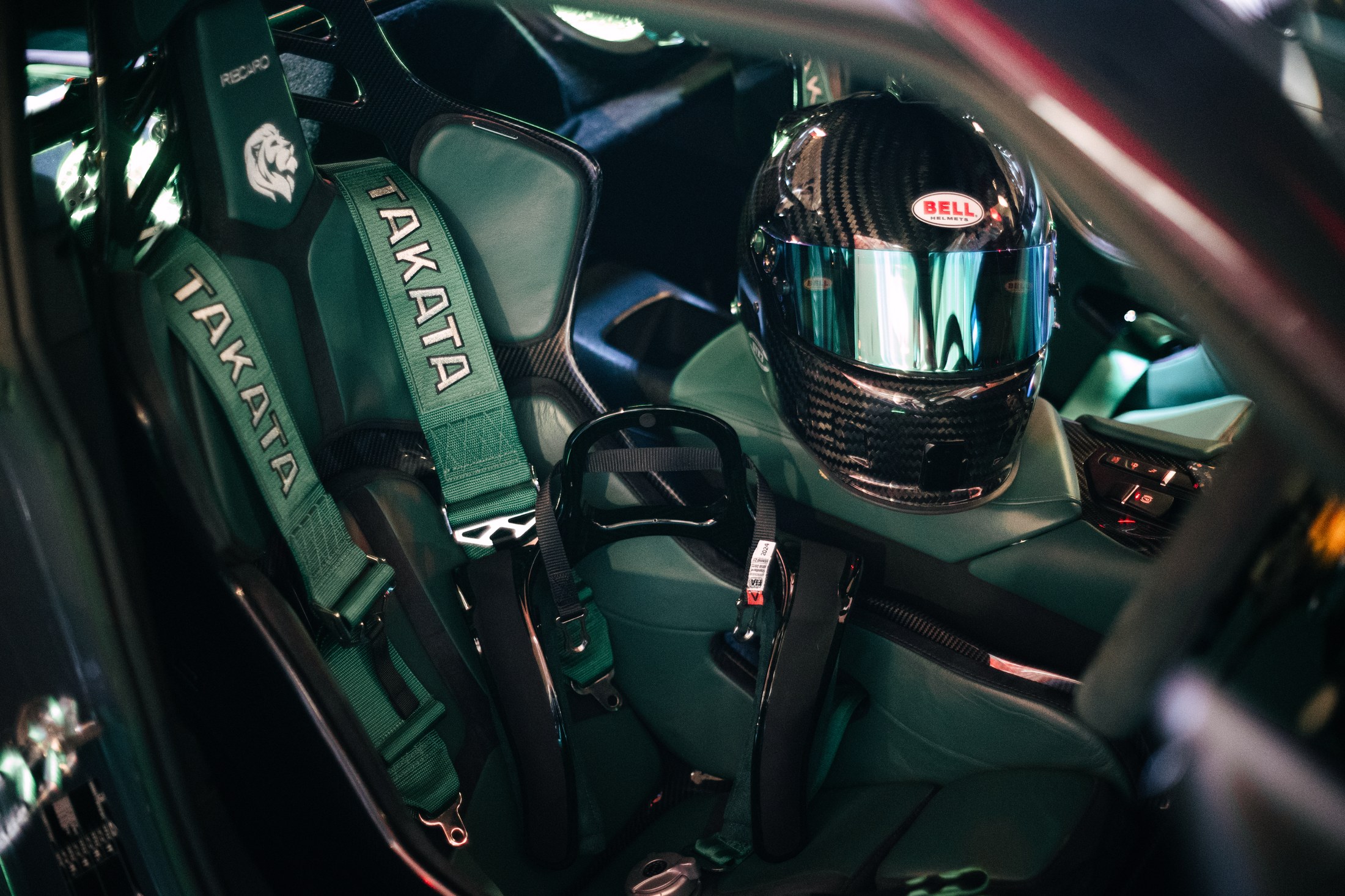 Recaro carbon fibre Podium bucket seat with green Takata harness and Bell carbon helmet