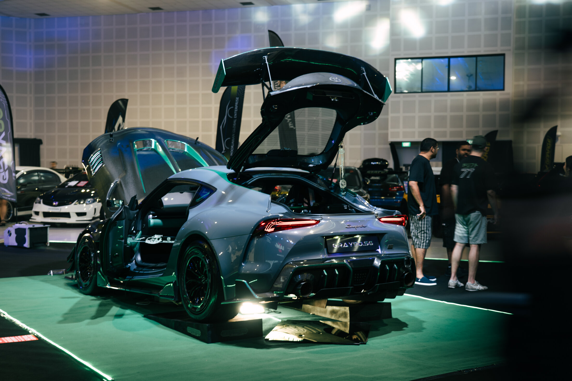 GRAY90.SG on the show floor, doors and hatch up, full display setup with lighting